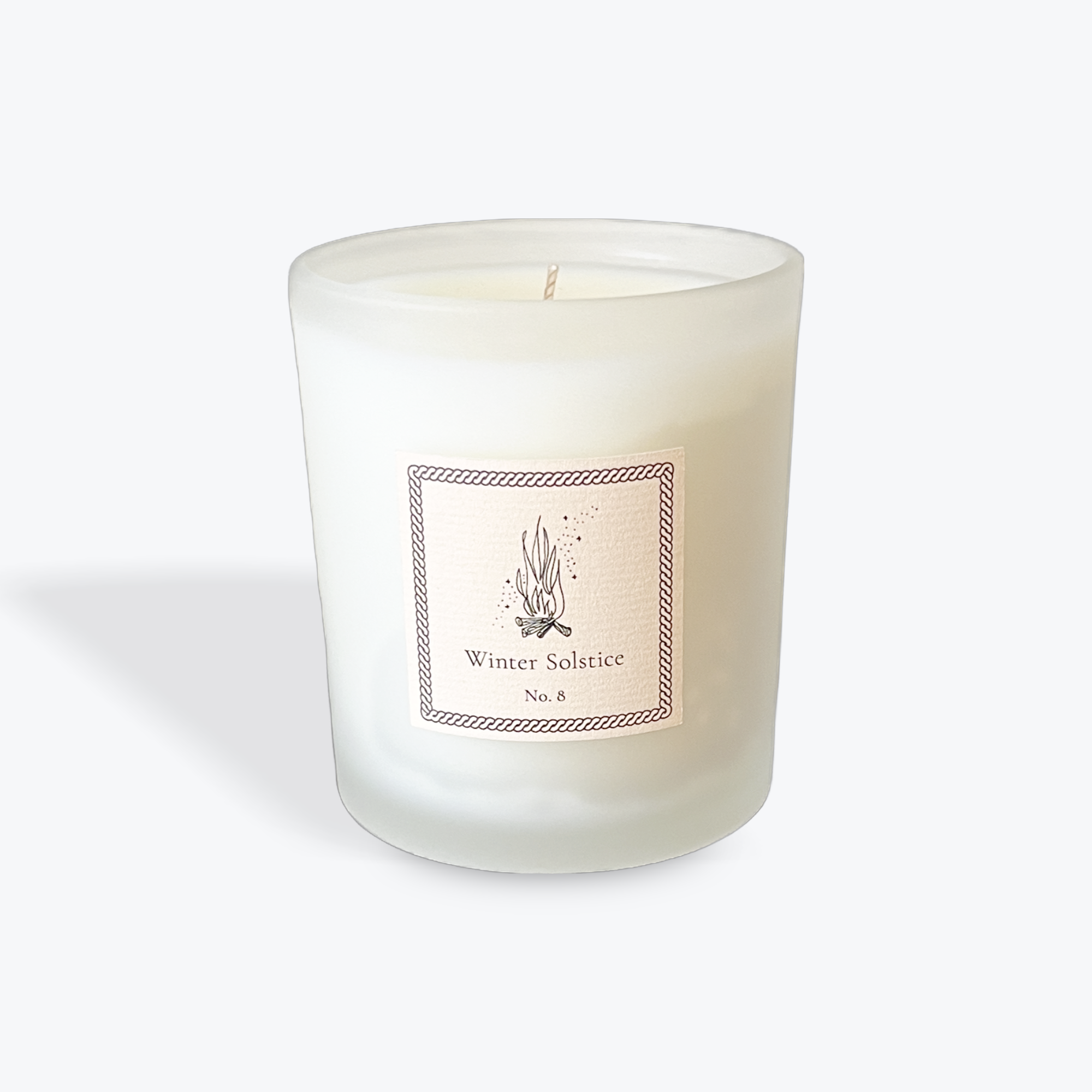 White candle with a label on a white background