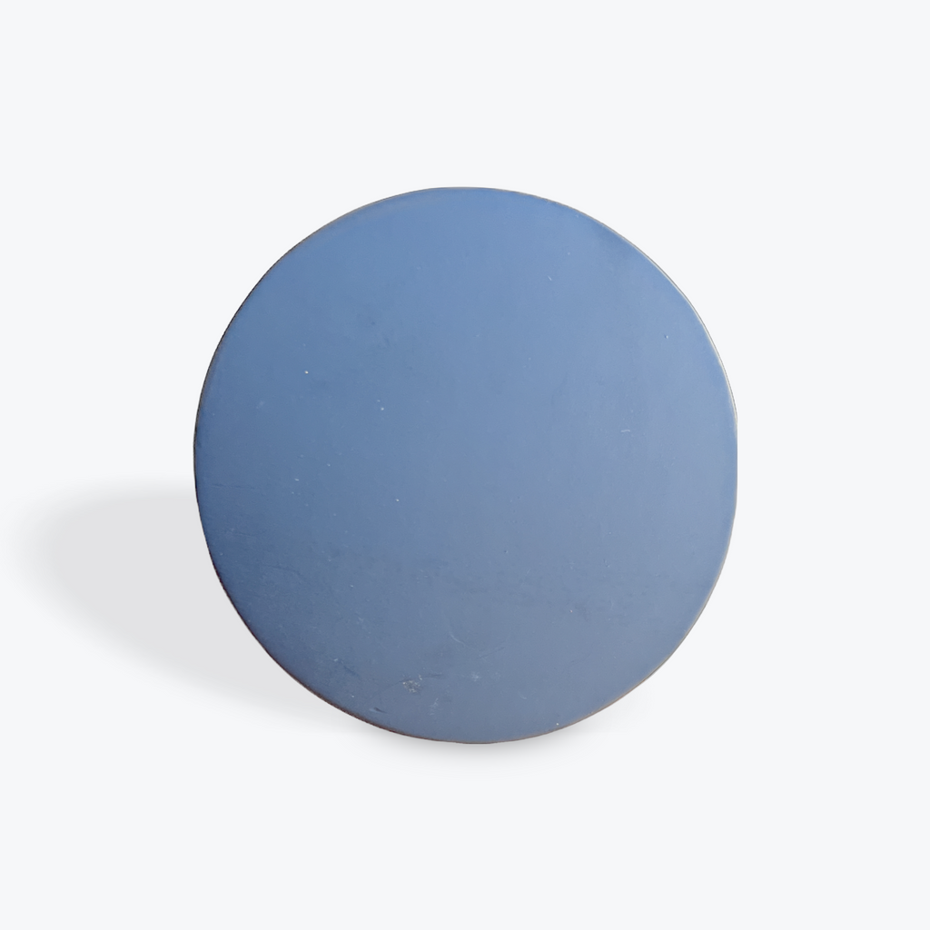 Black circular object on a white background