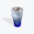 Blue recycled drinking glass on a white background