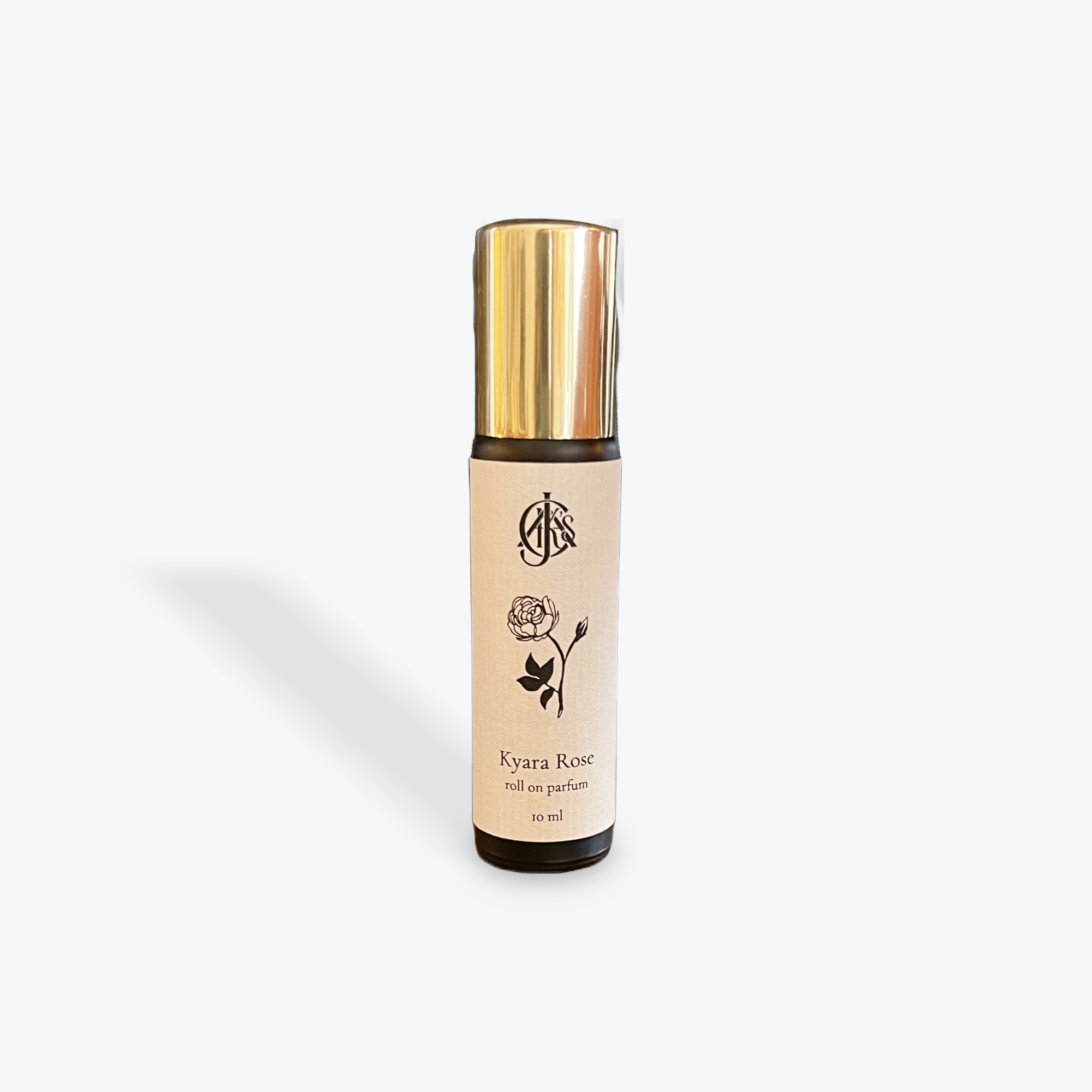 Perfume bottle with gold cap and beige label on a white background