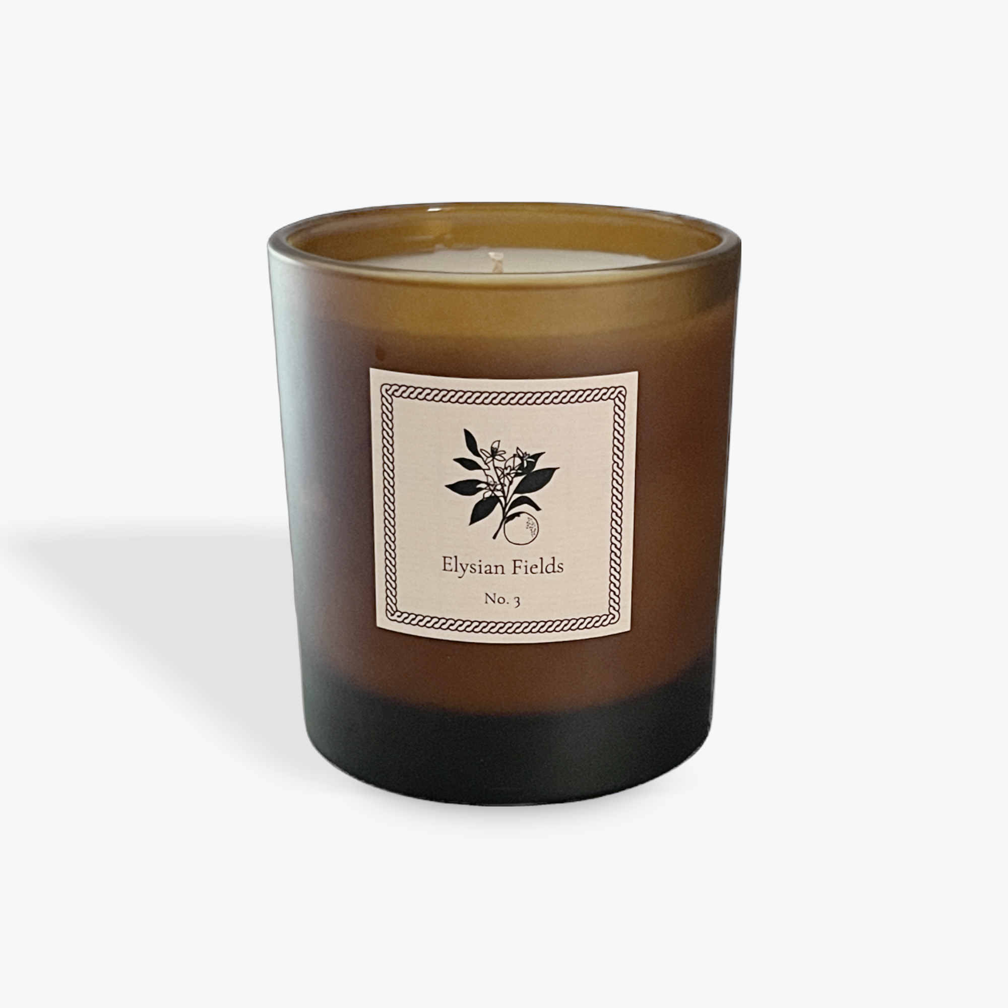 Brown candle with a label on a white background