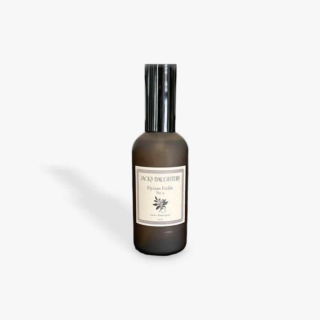 Bottle of Elysian Fields room spray on a white background