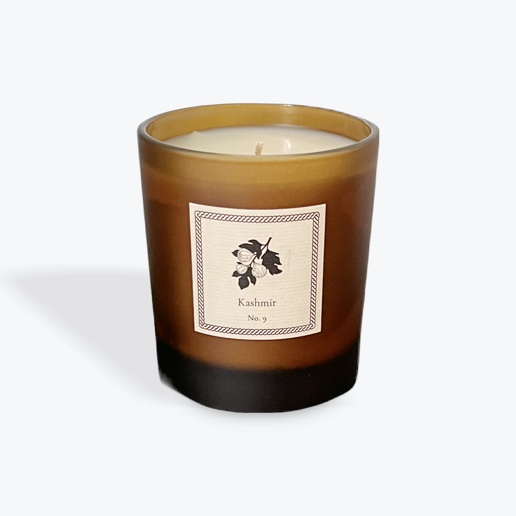 Candle with a label on a white background