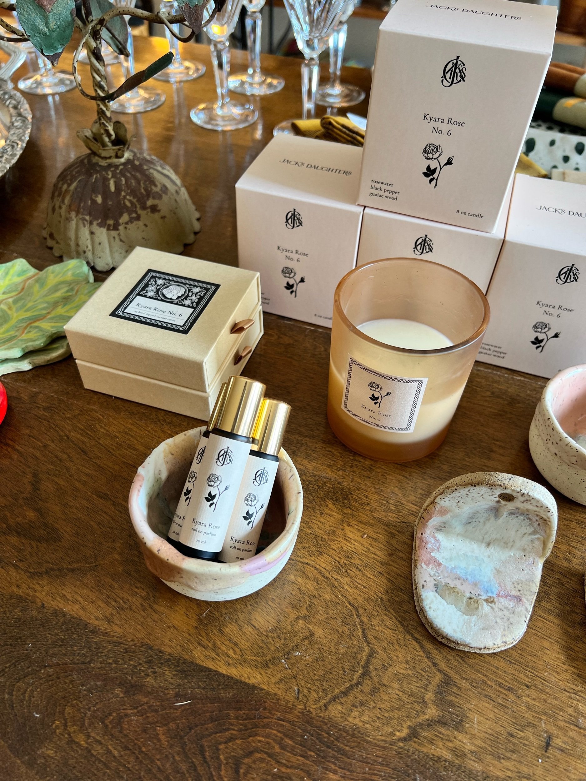 Kyara Rose products with packaging on a wooden table