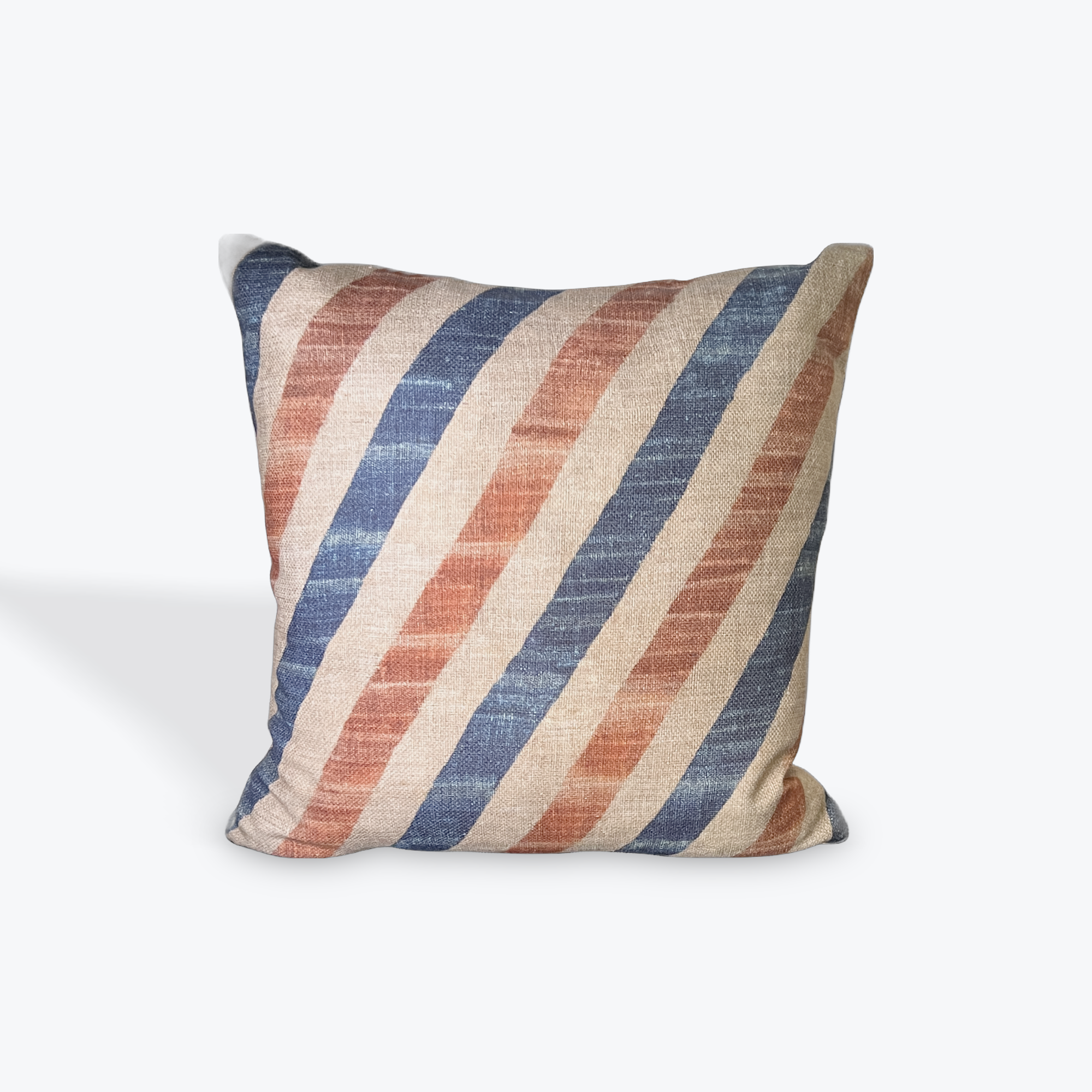 Striped pillow with red, blue, and beige colors on a white background