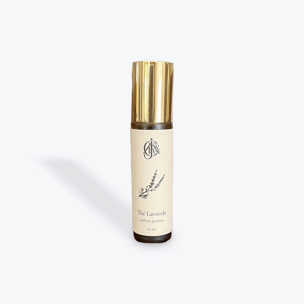 Roll on parfum bottle labeled 'The Lavande' with gold cap on a white background. 