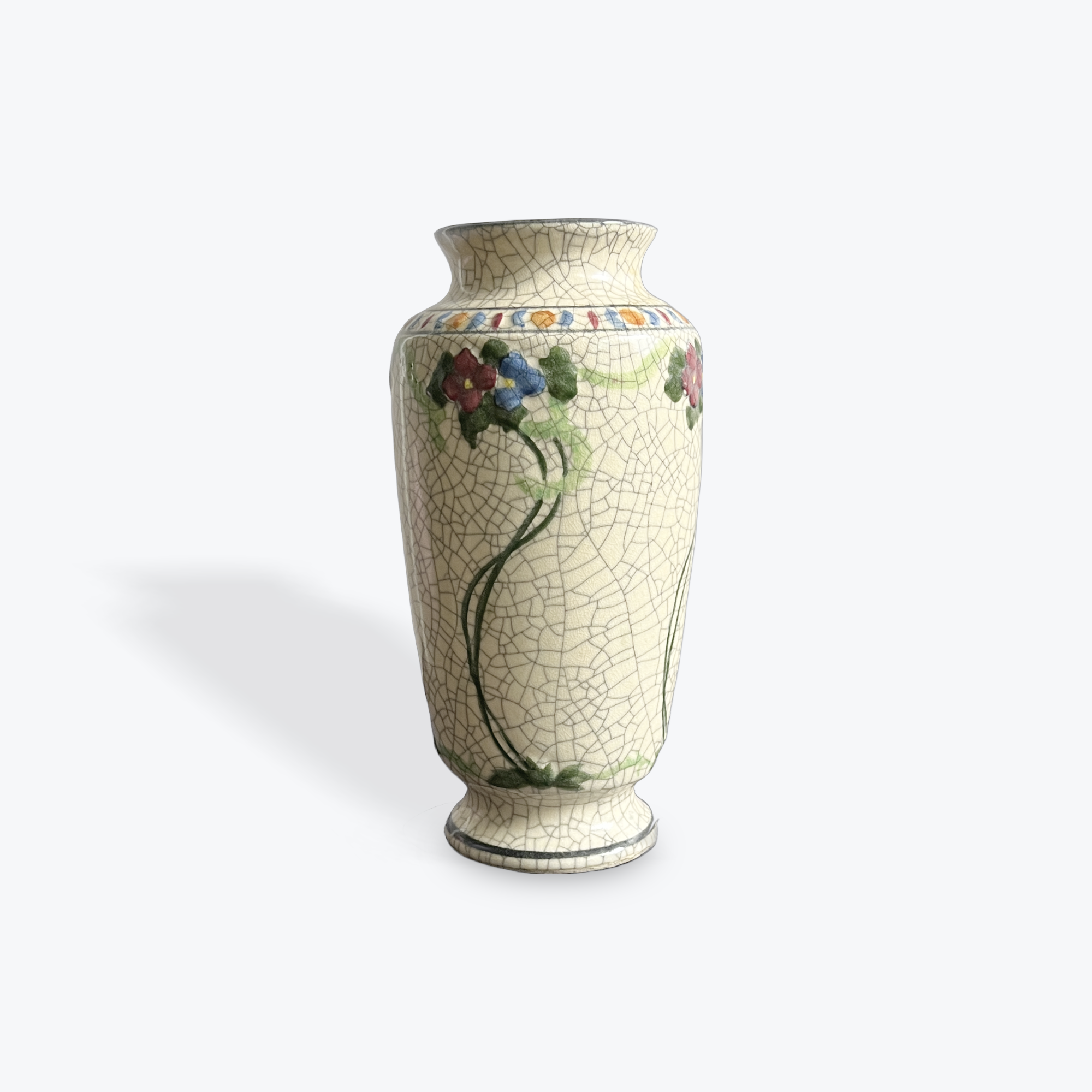 Decorative crackle vase with floral patterns on a white background