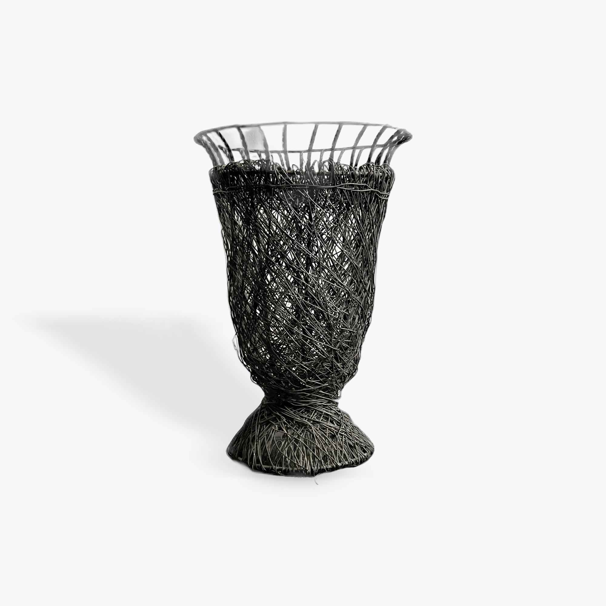 Black wire mesh vase on a white background
