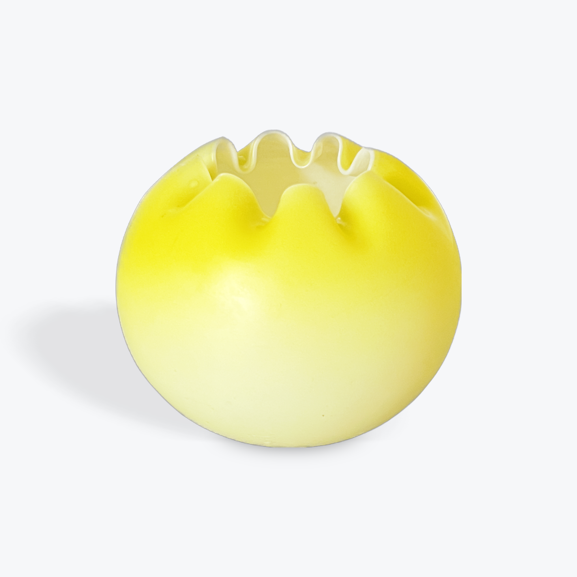 Yellow satin glass vase with wavy rim on a light gray background