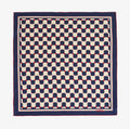 a blue and white checkered scarf with red dots on a white background