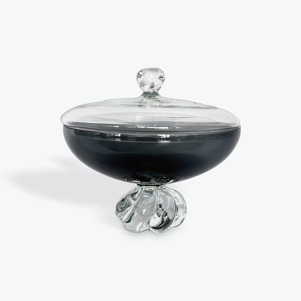 Glass container with a clear lid on a white background