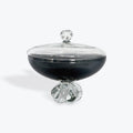 Glass container with a clear lid on a white background