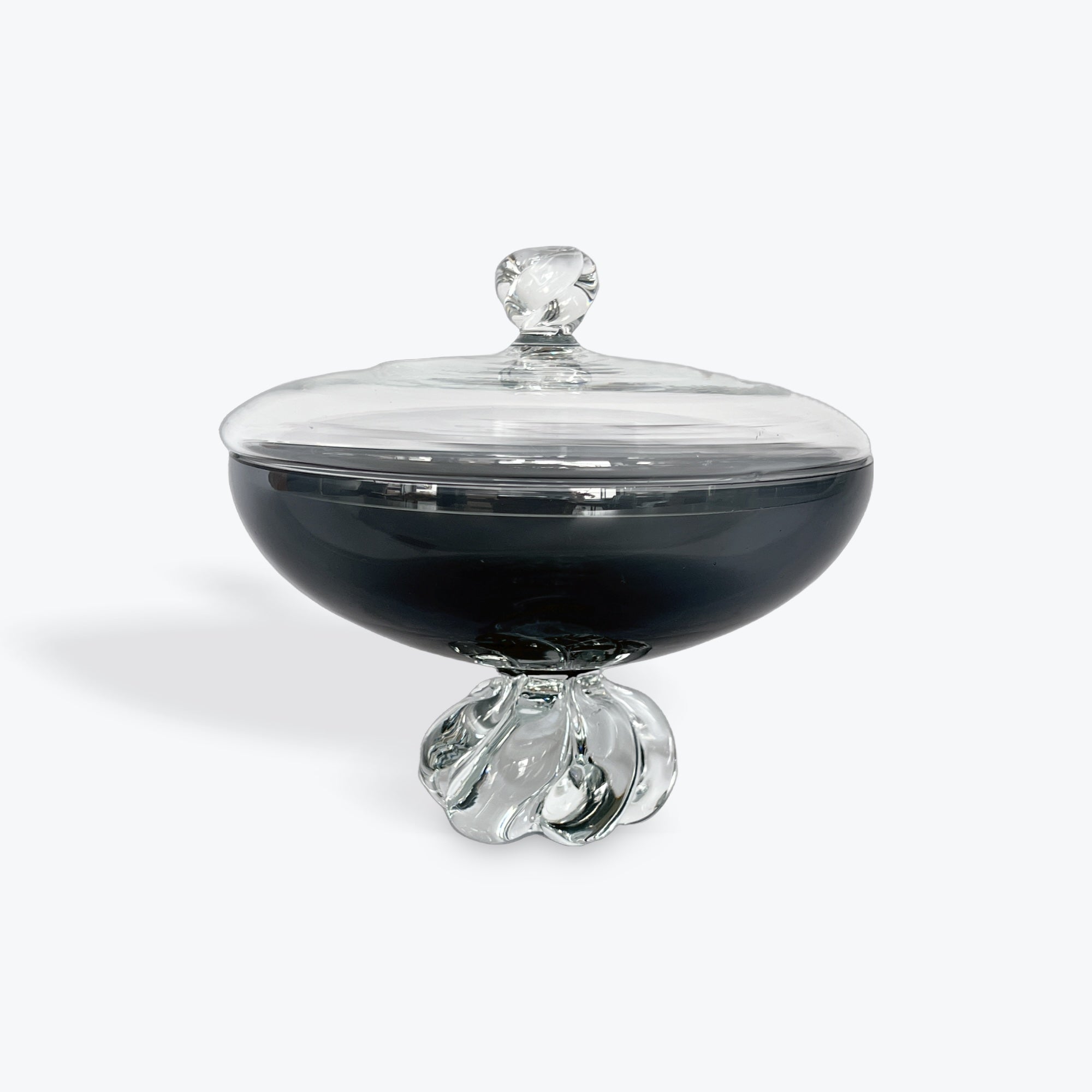 Glass container with a clear lid on a white background