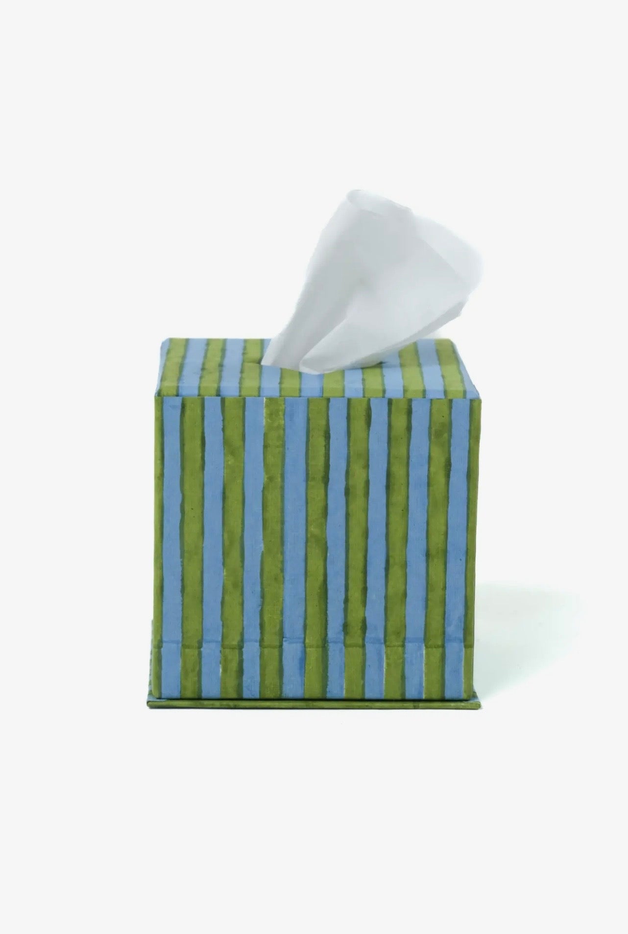 Blue and green striped tissue box with tissues on a white background