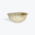 Beige ceramic bowl on a white background