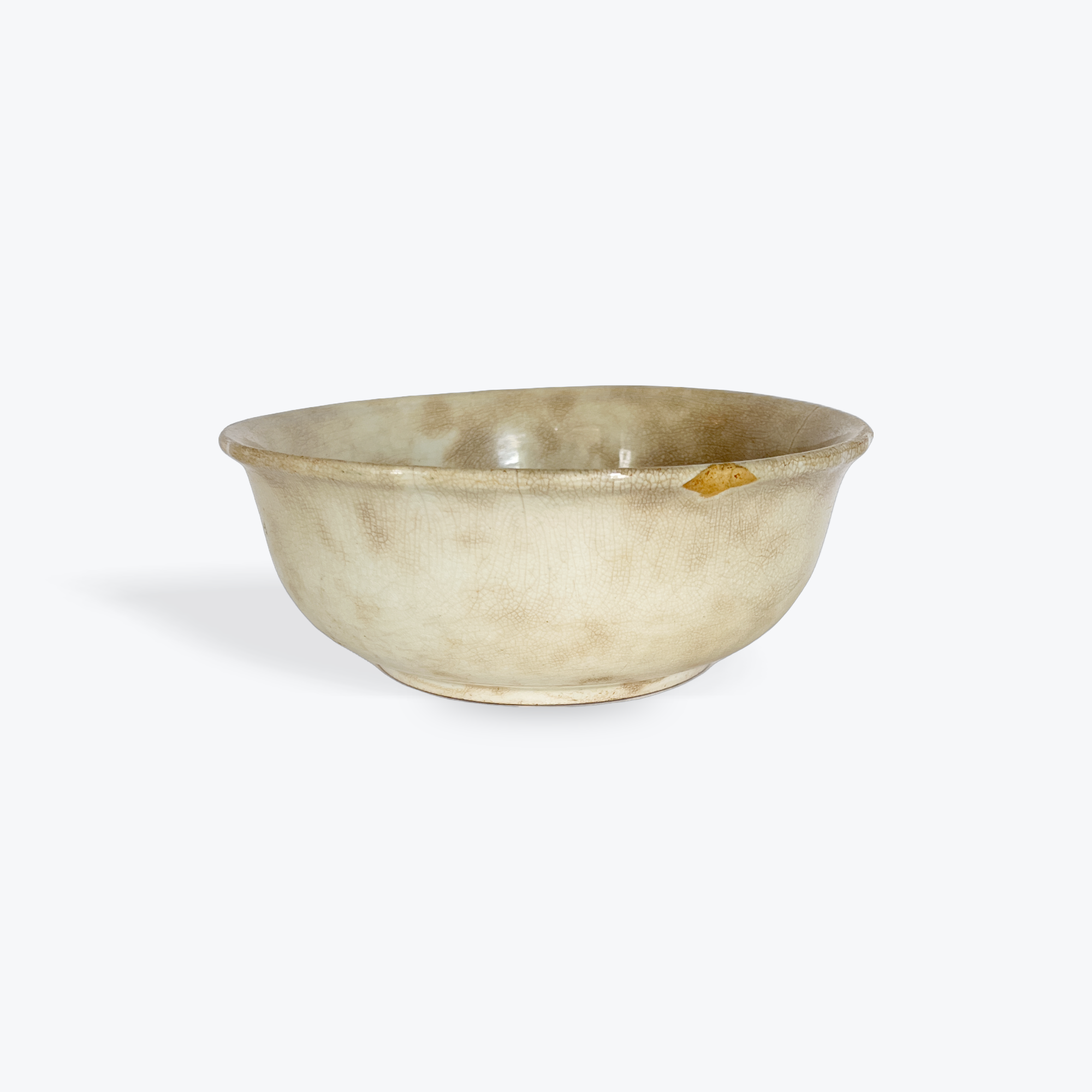 Beige ceramic bowl on a white background