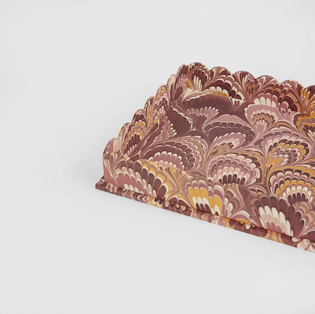 A detailed image of a marbled burgundy and gold tray with scalloped edge on a white background