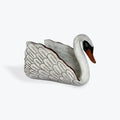 White ceramic swan on a white background