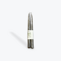 A pair of moss green taper candles on white background.