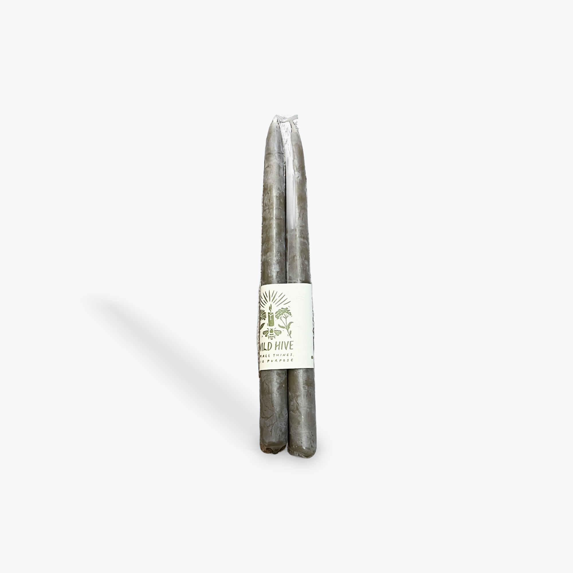 A pair of moss green taper candles on white background.